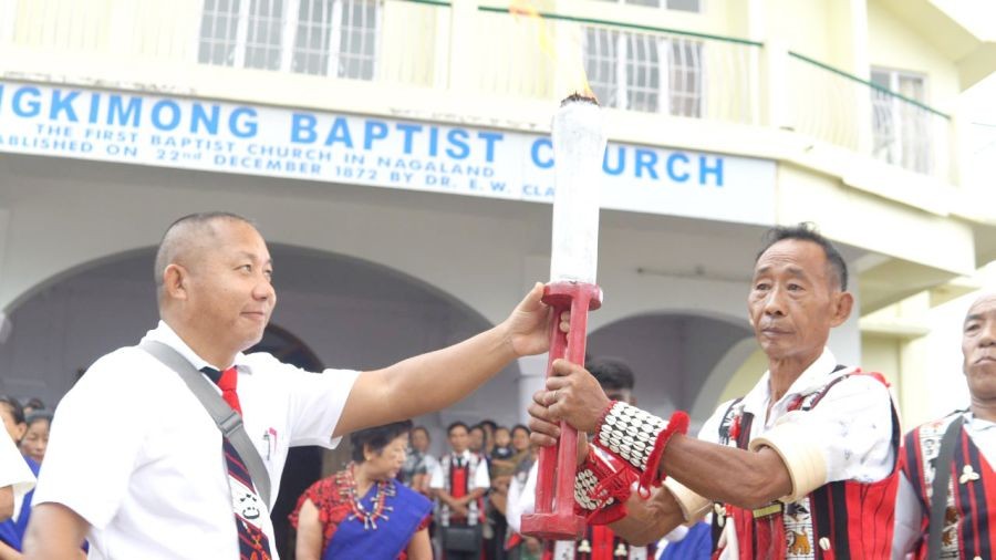 Molungkimong Baptist Church, Pastor, Rev Moaliba Tzudir and Village Council chairman Imsutemjen Tzudir seen holding the Dr EW Clark Gospel Torch after being lit at Molungkimong on September 4.